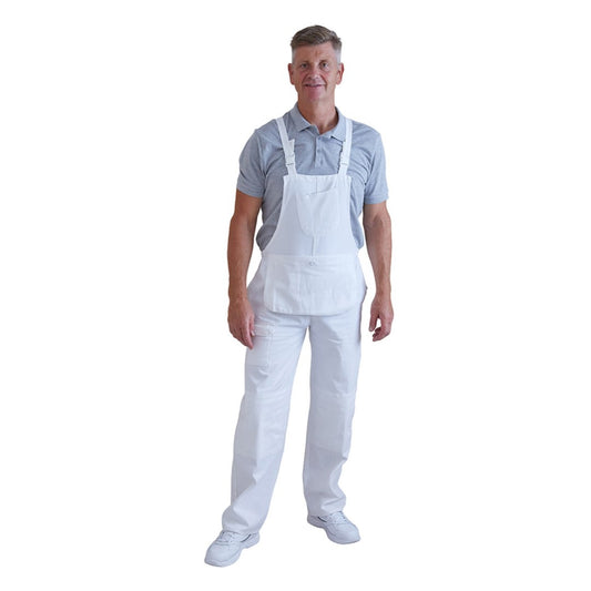 A man wearing white bib overalls over a light blue polo shirt and white shoes, standing against a plain white background.
