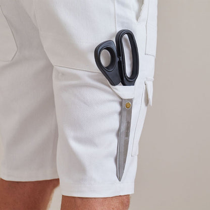 White decorators shorts with a side pocket holding a pair of black-handled scissors, shown on a model against a plain light beige background.