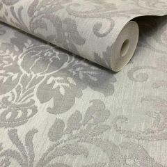 A fabric-style wallpaper with a light silver background and a darker silver glittering damask pattern on top.